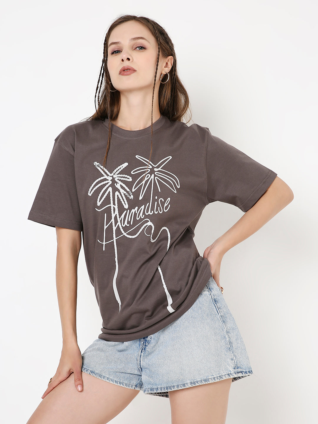 Steel grey relaxed fit t-shirt with white palm tree and "Paradise" script print, paired with denim shorts.