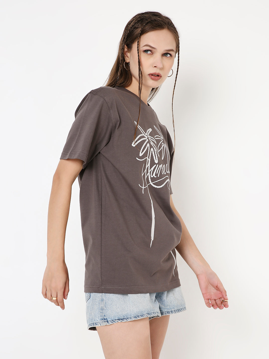 Steel grey relaxed fit t-shirt with white abstract script print, paired with light denim shorts.