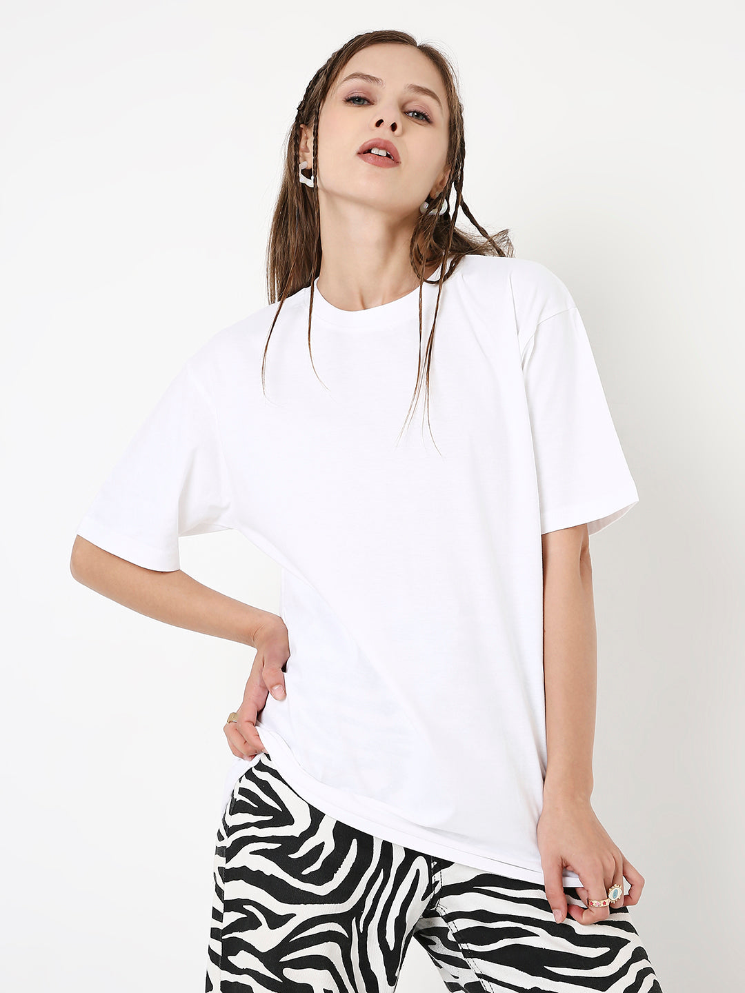White relaxed fit short-sleeve T-shirt paired with black and white zebra print pants.