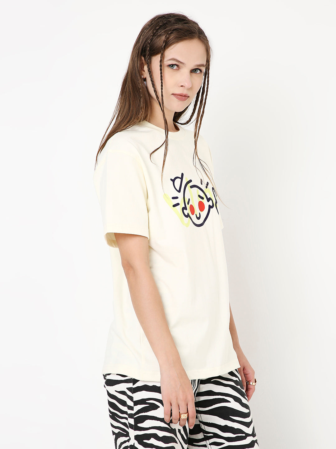 Off-white relaxed fit t-shirt with playful graphic face print on front.
