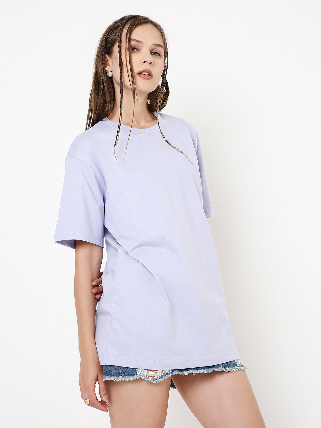 Lavender relaxed-fit crewneck T-shirt with short sleeves worn with denim shorts.