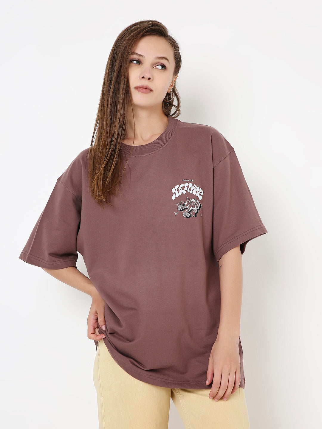 Oversize old rose cotton T-shirt with small white and black graphic on chest, crew neck, short sleeves.