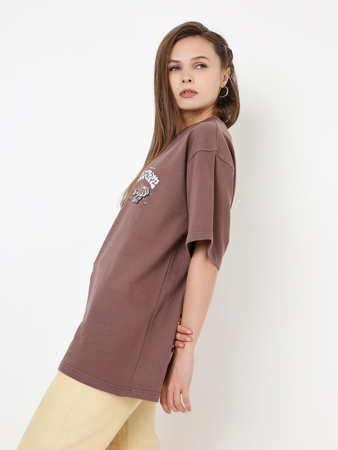 Oversize old rose t-shirt with short sleeves and small printed design on chest, worn by model.