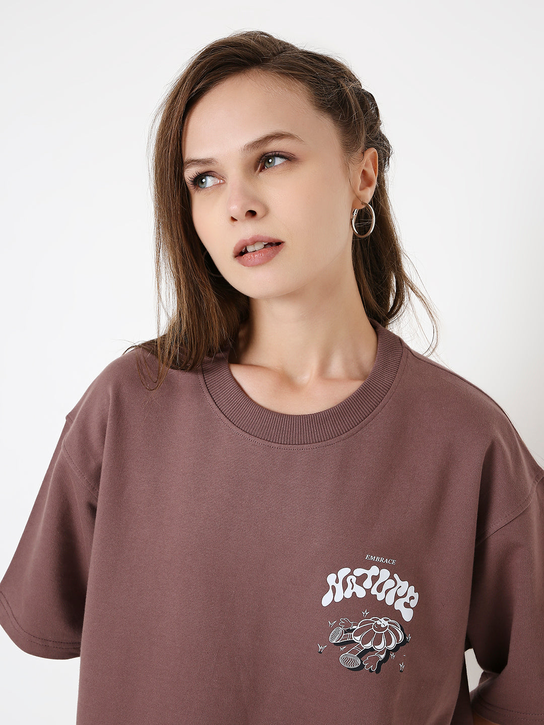 Oversize old rose oversized t-shirt with small white and black graphic print on left chest.