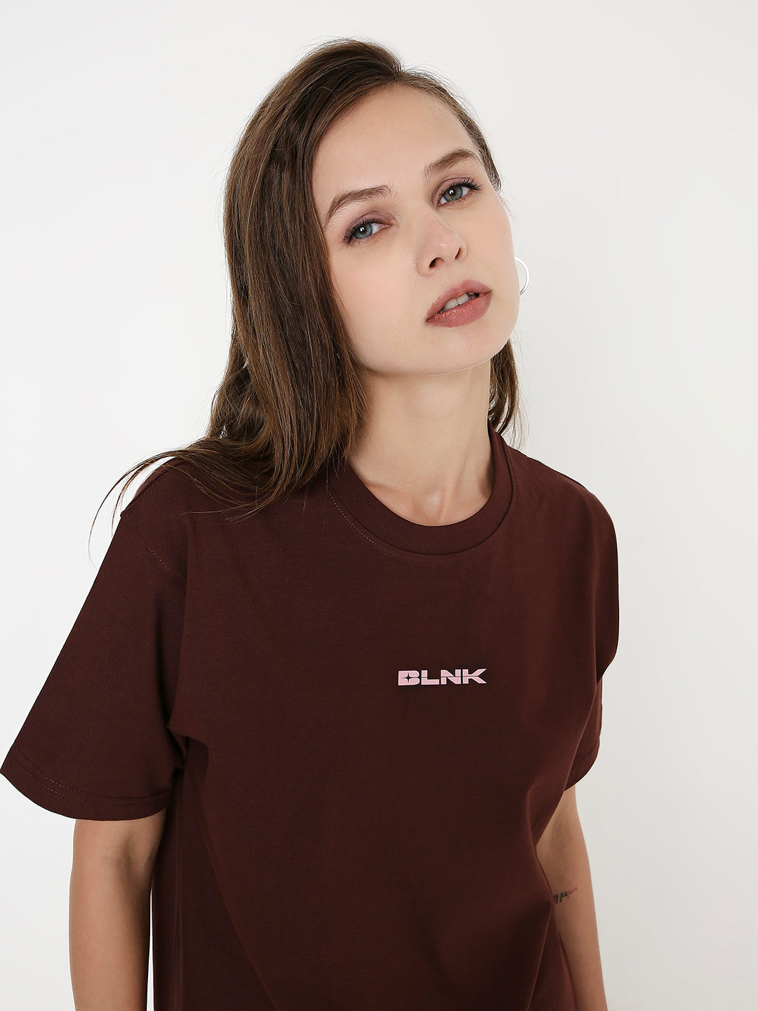 Brown relaxed-fit t-shirt with small white "BLNK" print on chest, crew neck, short sleeves.