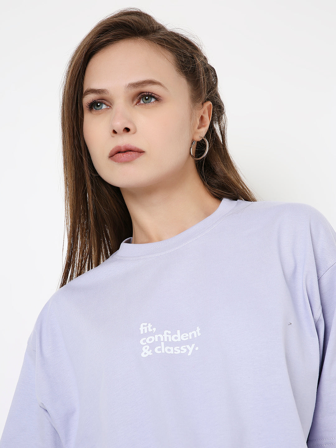 Lavender oversized crop top with white "Be confident & classy" text on chest, crew neck style.
