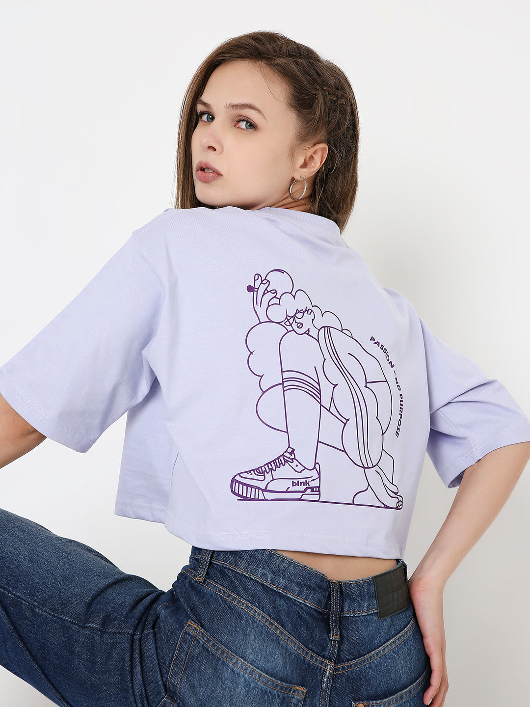 Lavender oversized crop top with abstract line art print on the back and short sleeves.