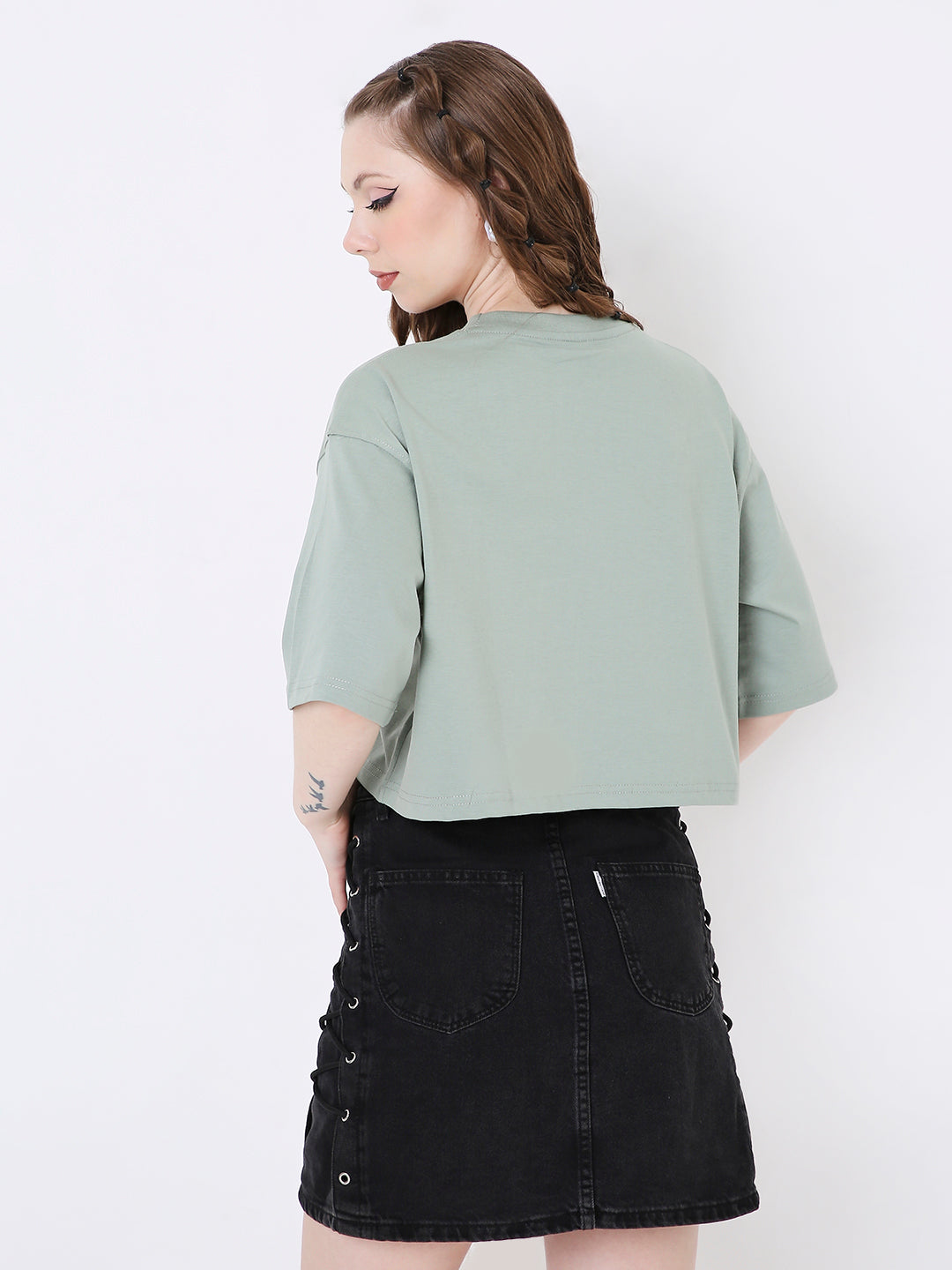 Oversize sage green crop top with elbow-length sleeves and relaxed fit.