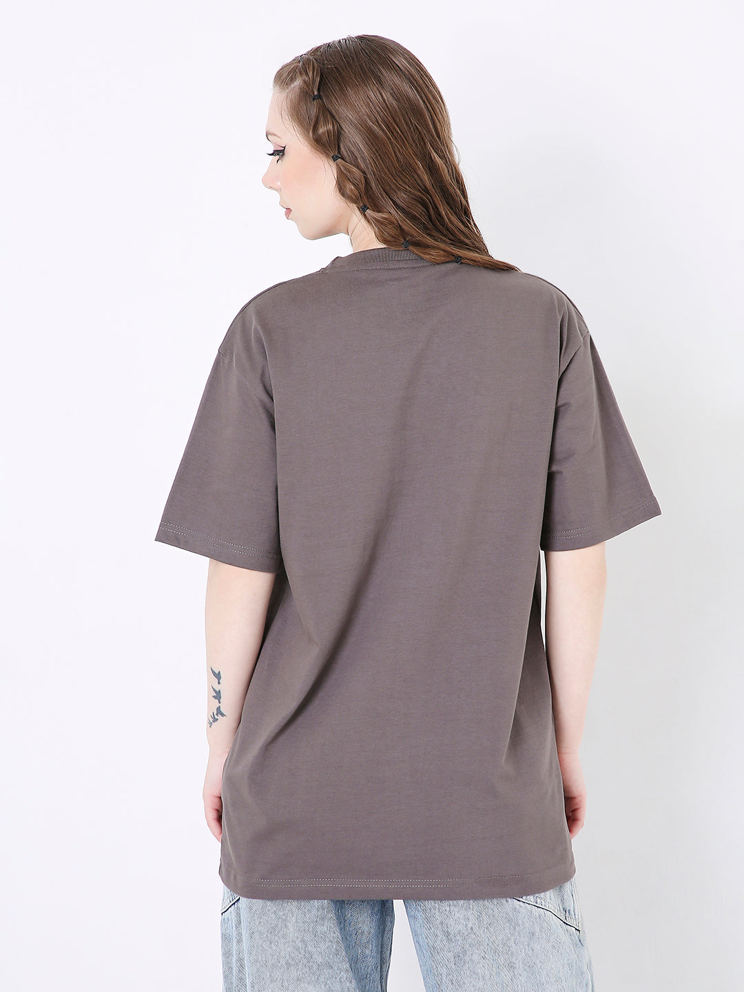 Relaxed fit steel grey solid t-shirt with short sleeves, worn by a woman shown from the back.