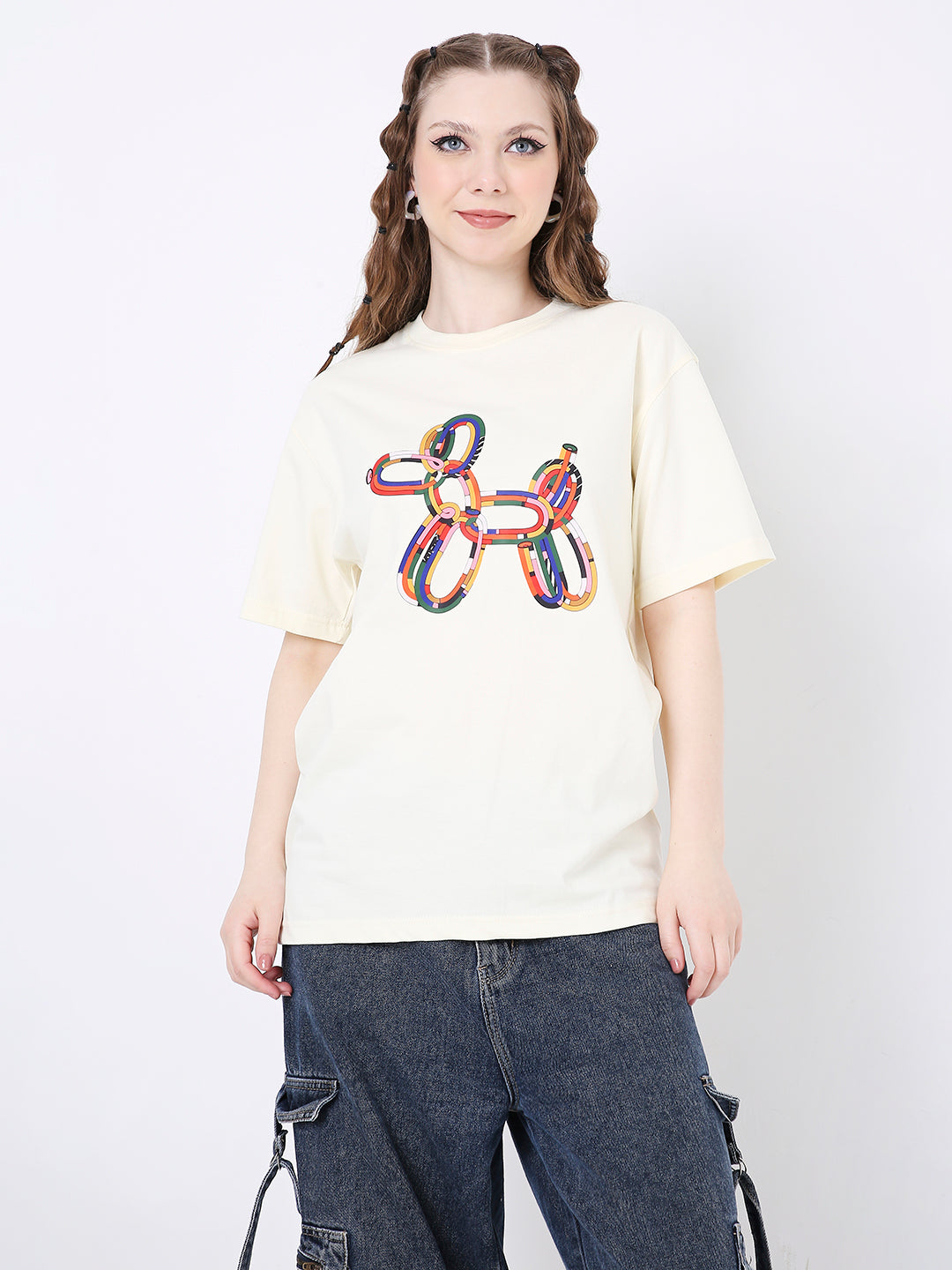 Off-white relaxed fit t-shirt with colorful balloon dog graphic on front, paired with dark cargo pants.