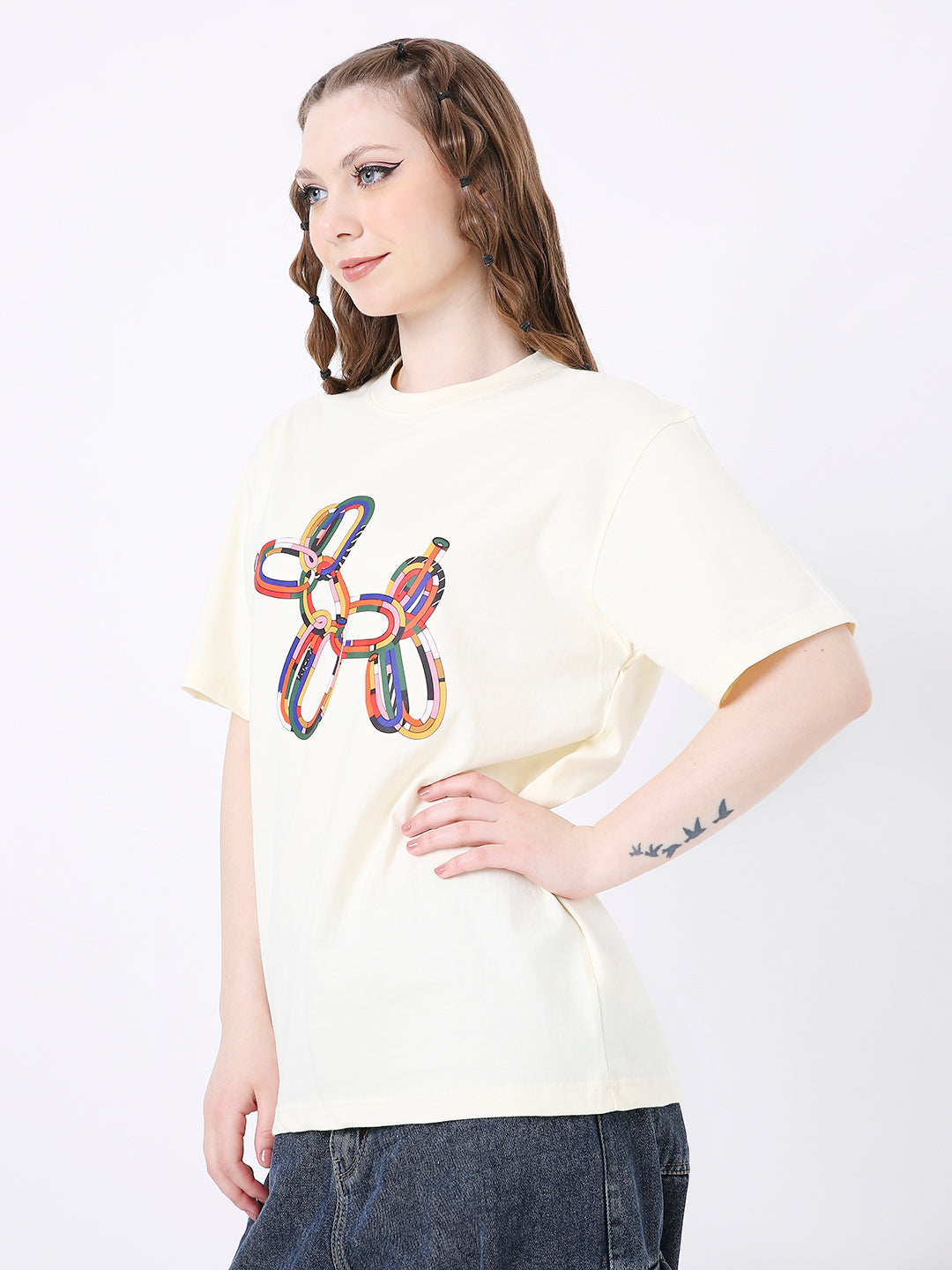 Off-white relaxed fit t-shirt with colorful balloon dog graphic on front.