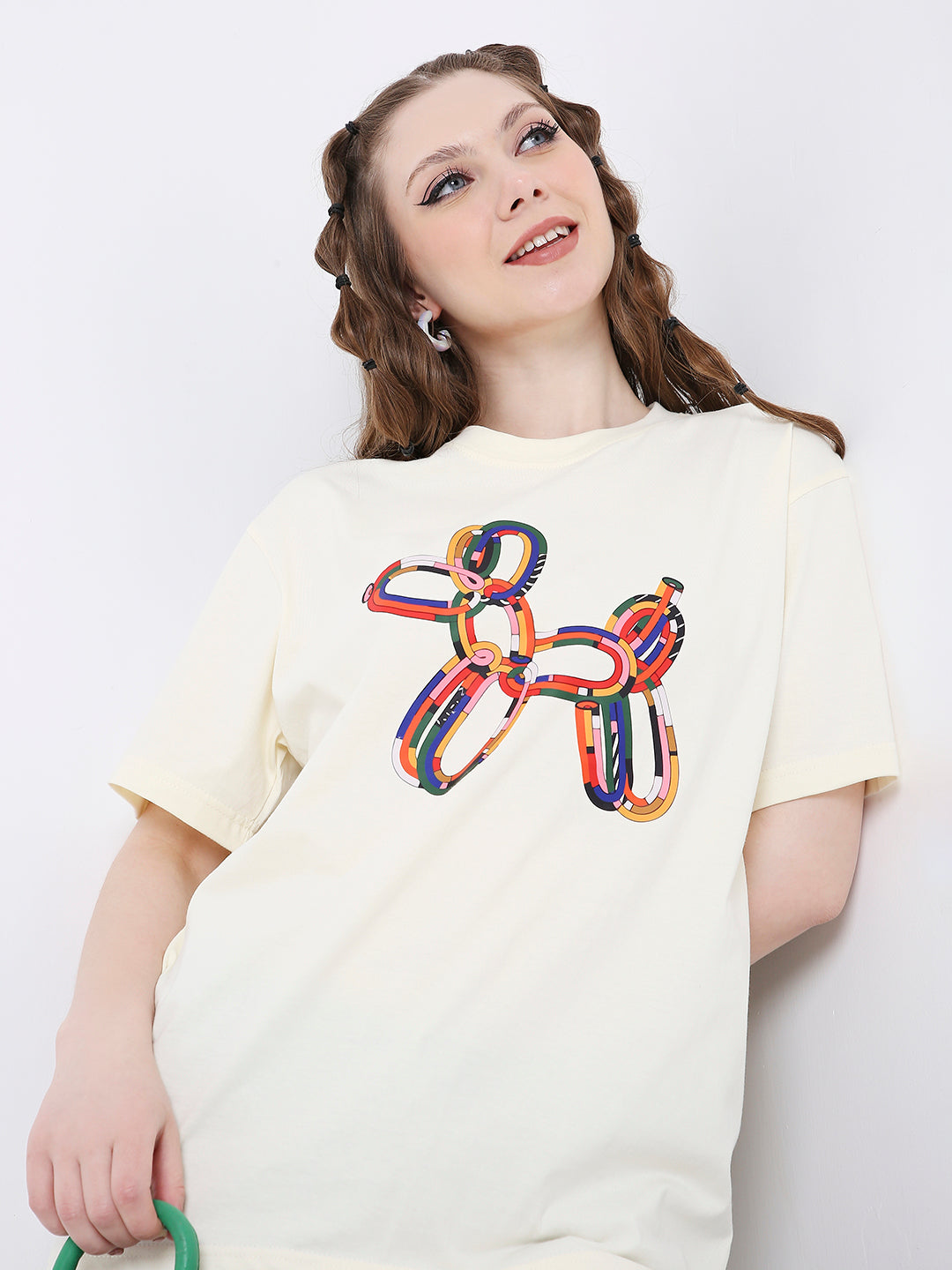 Off-white relaxed fit t-shirt with colorful balloon dog graphic on front.