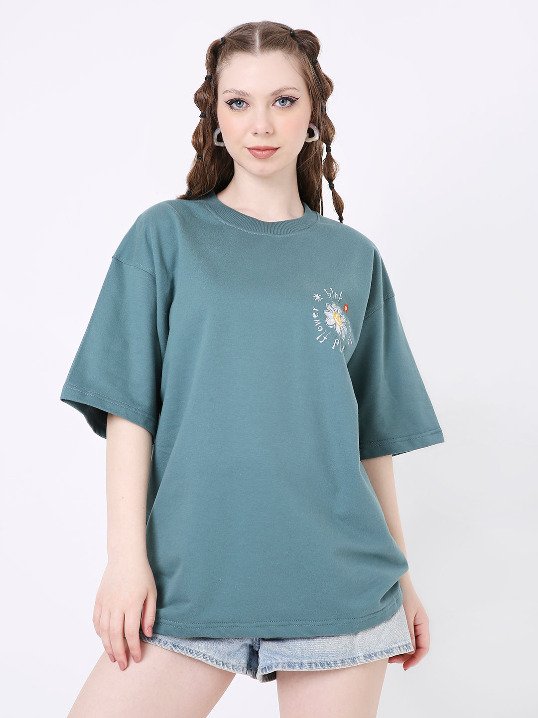 Oversize sapphire blue t-shirt with small floral print on chest and relaxed fit.