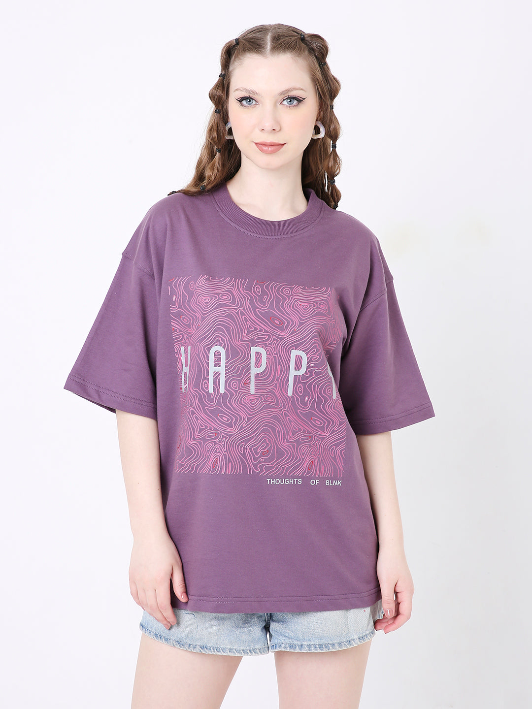 Purple oversized T-shirt with pink grape print and white "YAPP" text, worn with denim shorts.