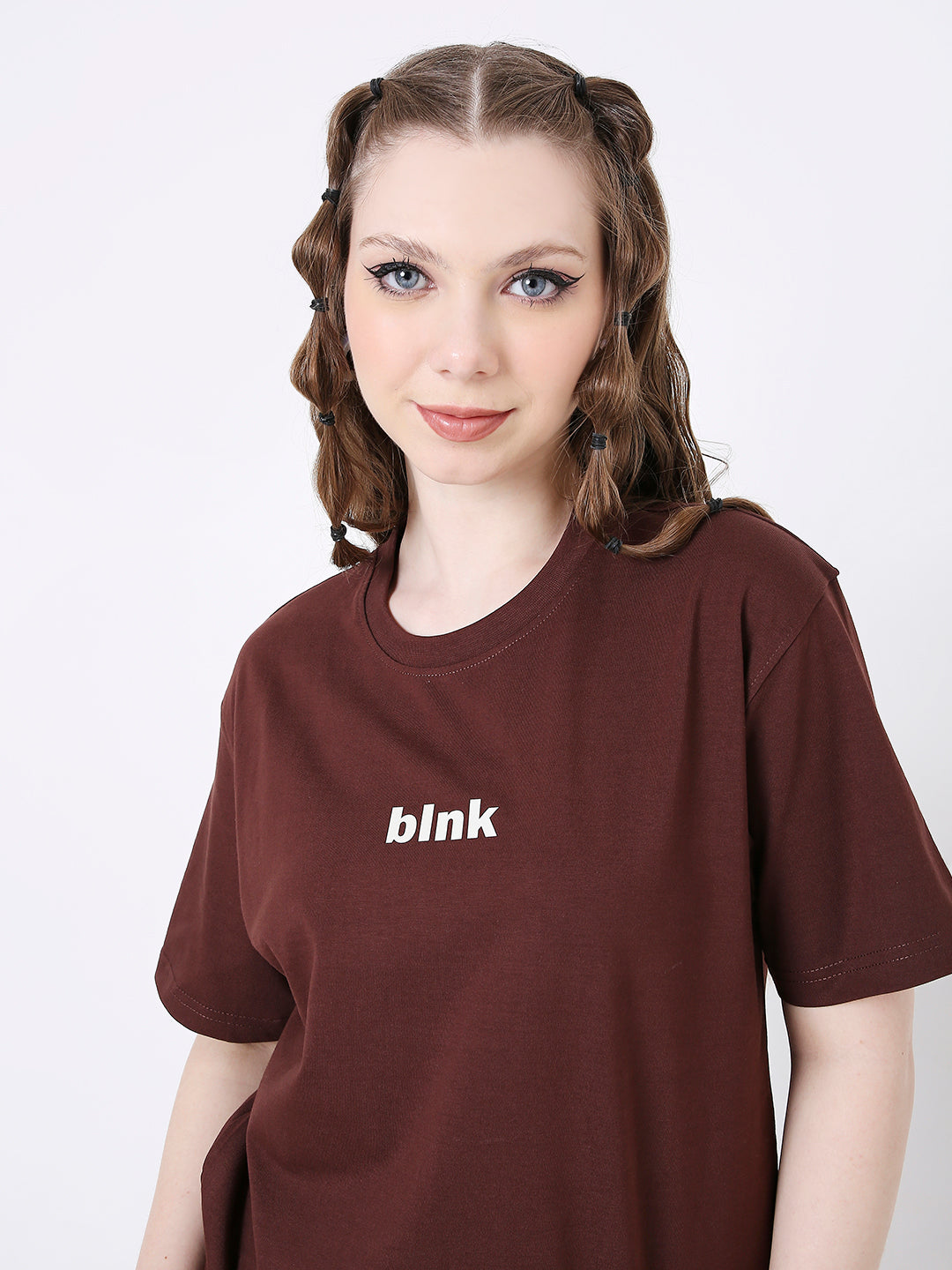 Brown relaxed fit t-shirt with white "blink" text on chest, round neck and short sleeves.