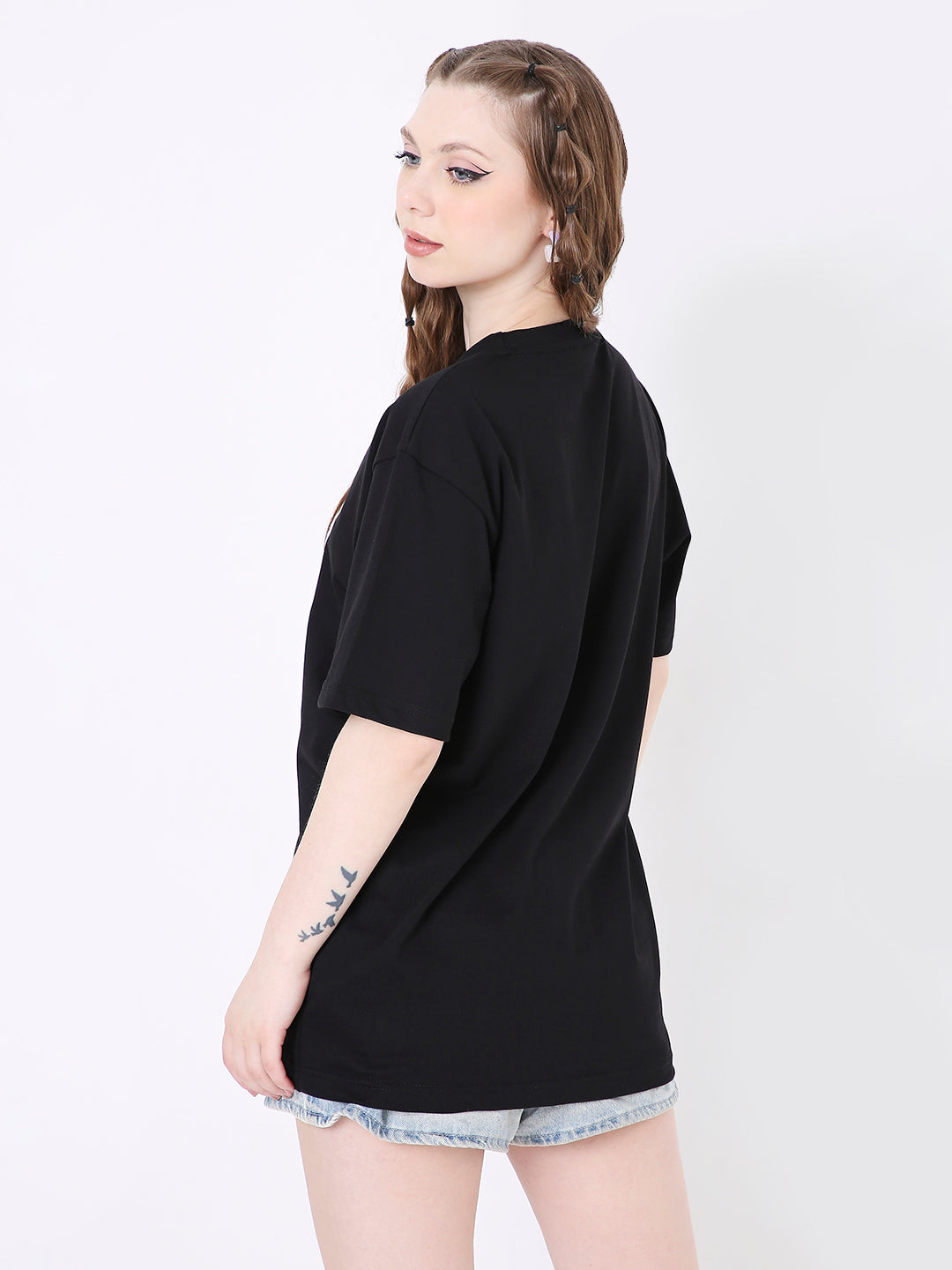 Black relaxed fit short-sleeve T-shirt with crew neck worn with denim shorts, shown from back and side angle.