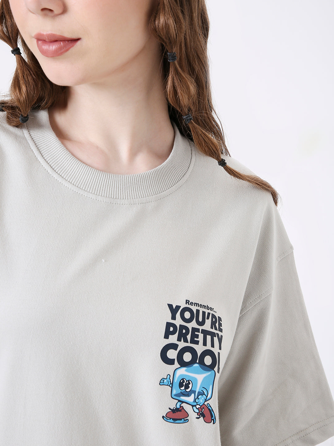 Light gray oversized T-shirt with blue skipping stone character and "You're Pretty Cool" text on chest.