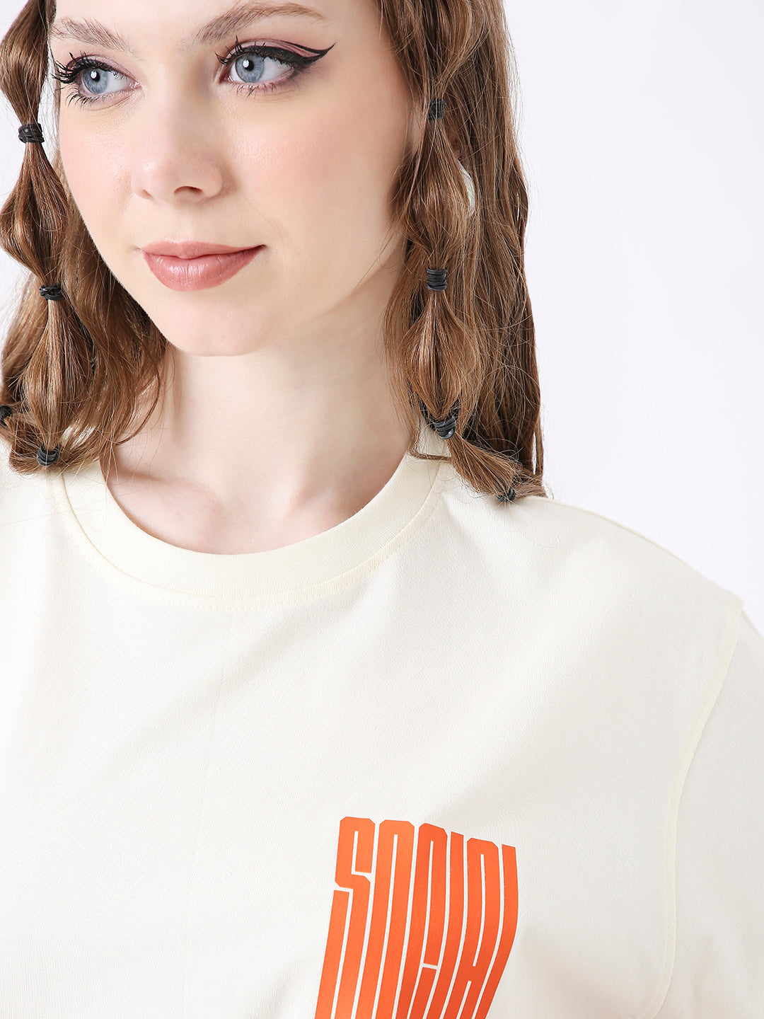 Off-white relaxed fit t-shirt with orange vertical block text print on the chest.