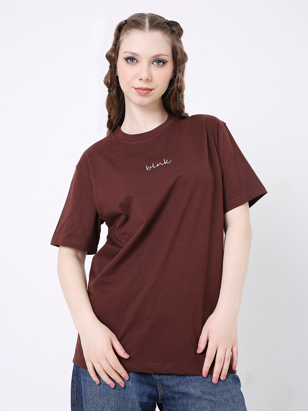 Relaxed fit brown T-shirt with small white printed text on chest worn by model.