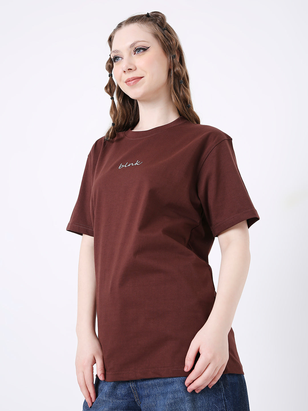 Brown relaxed fit t-shirt with small white printed text on chest, short sleeves, crew neck.