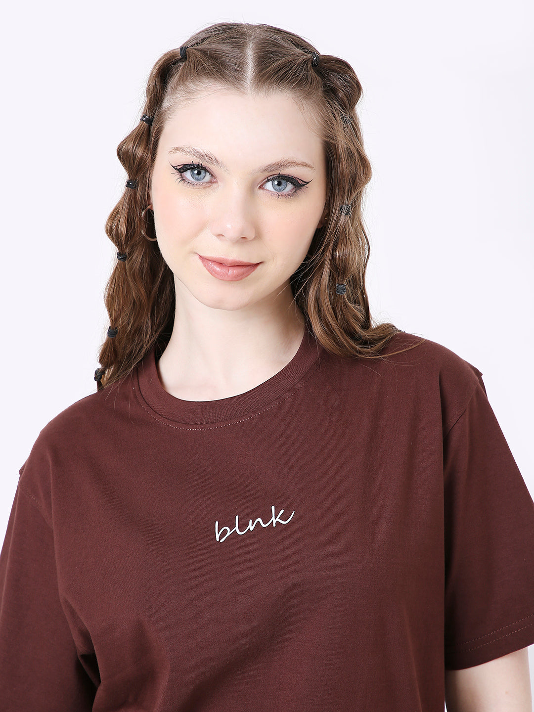 Brown relaxed fit t-shirt with small white "blink" text on chest, crew neck, short sleeves.