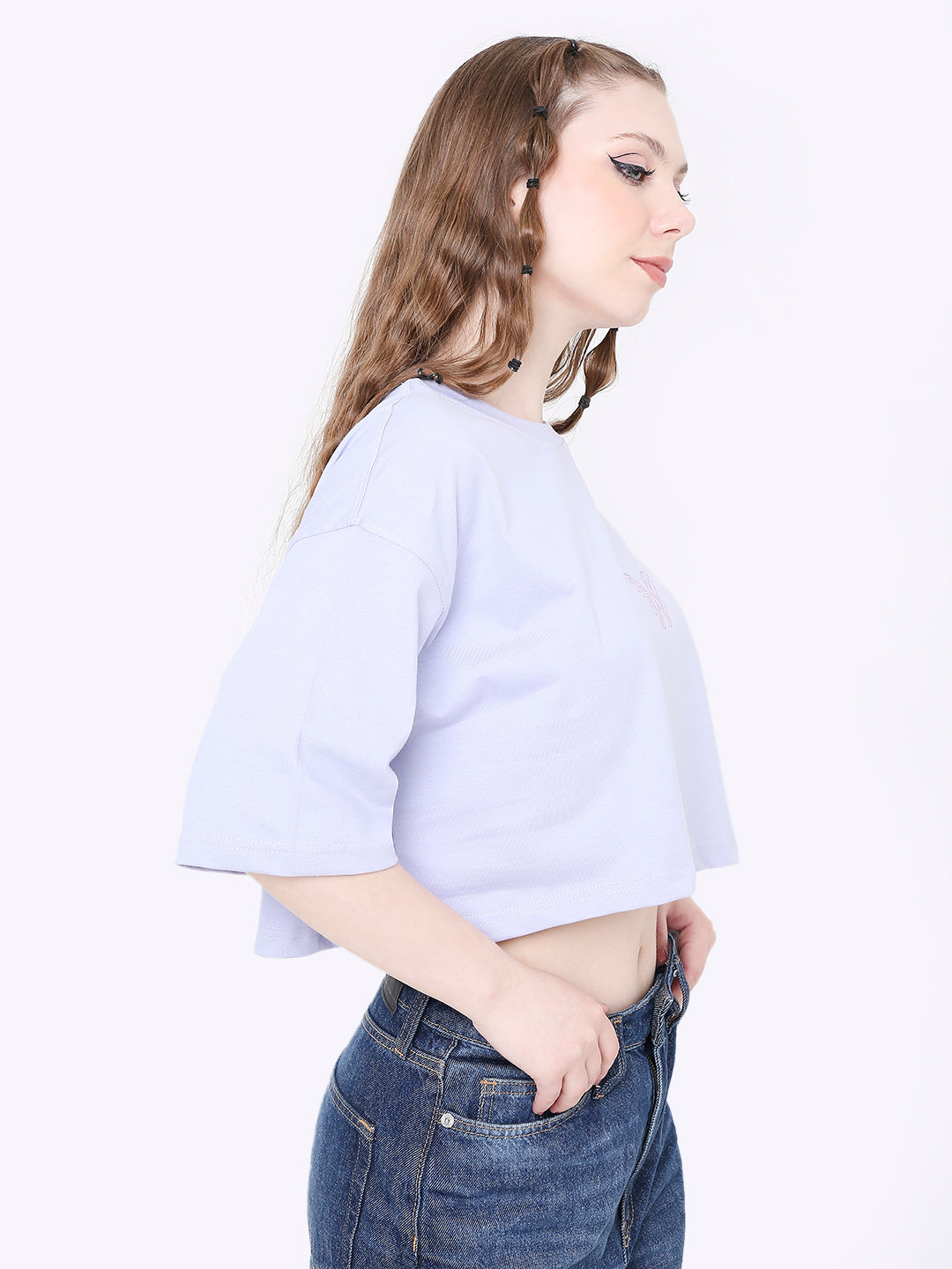 Oversize lavender crop top with drop shoulders and relaxed fit, worn with high-waisted jeans.