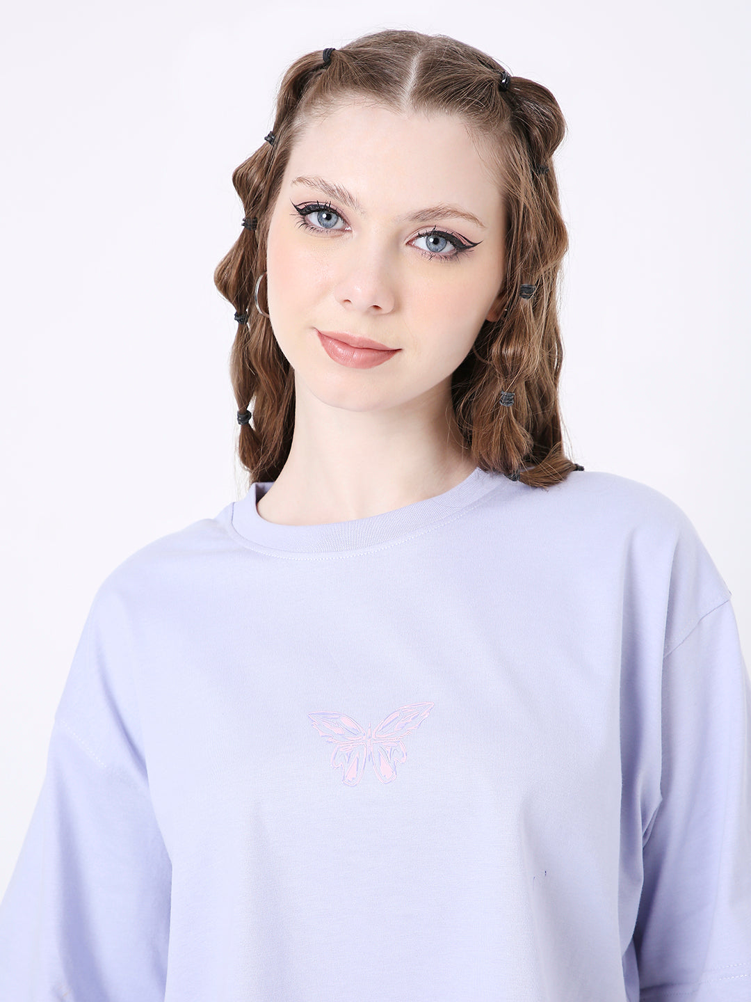 Lavender oversized crop top with subtle printed design on front, crew neckline, and relaxed fit.