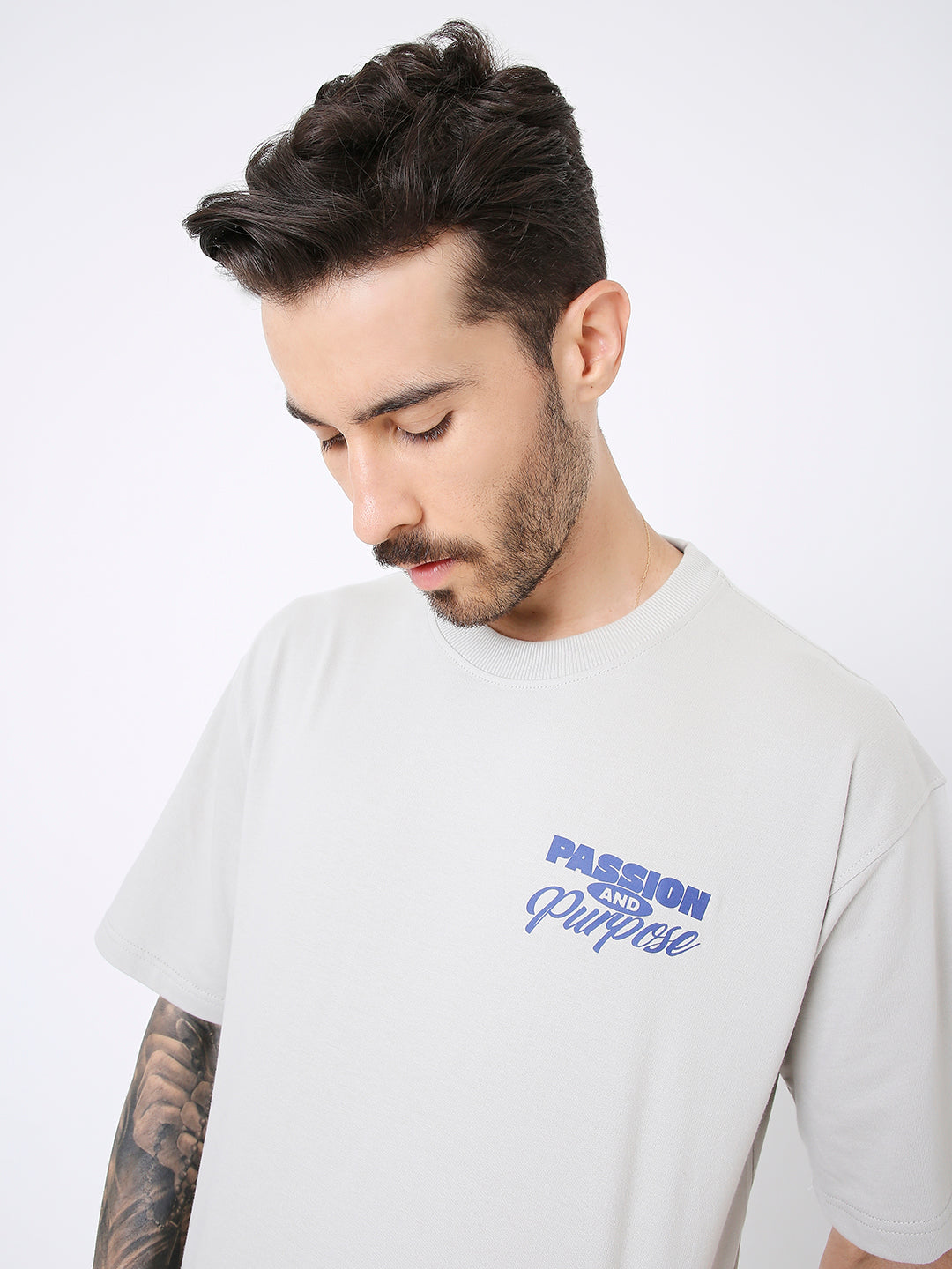 Light gray oversized T-shirt with blue "Passion Graphic" text on chest and crew neckline.