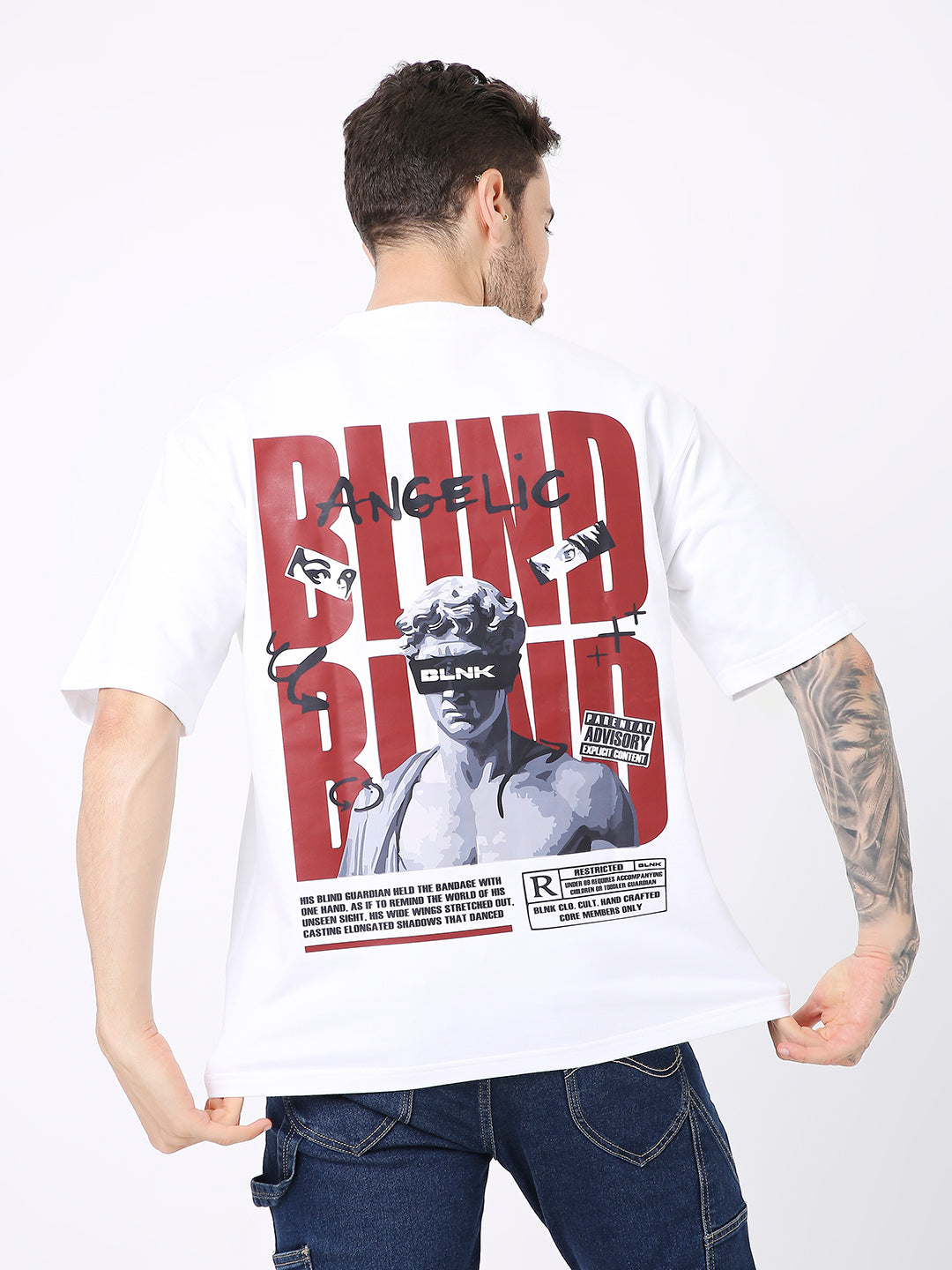 Oversize white t-shirt with large red and black graphic print on the back featuring a portrait and bold text.
