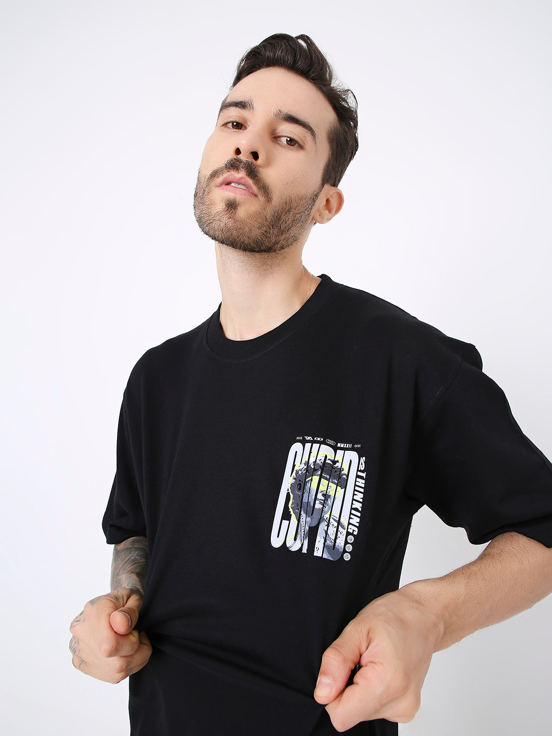 Black oversized T-shirt with white graphic print on chest pocket area.