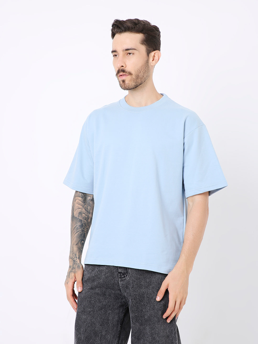 Light blue oversized short-sleeve t-shirt with crew neck on male model.