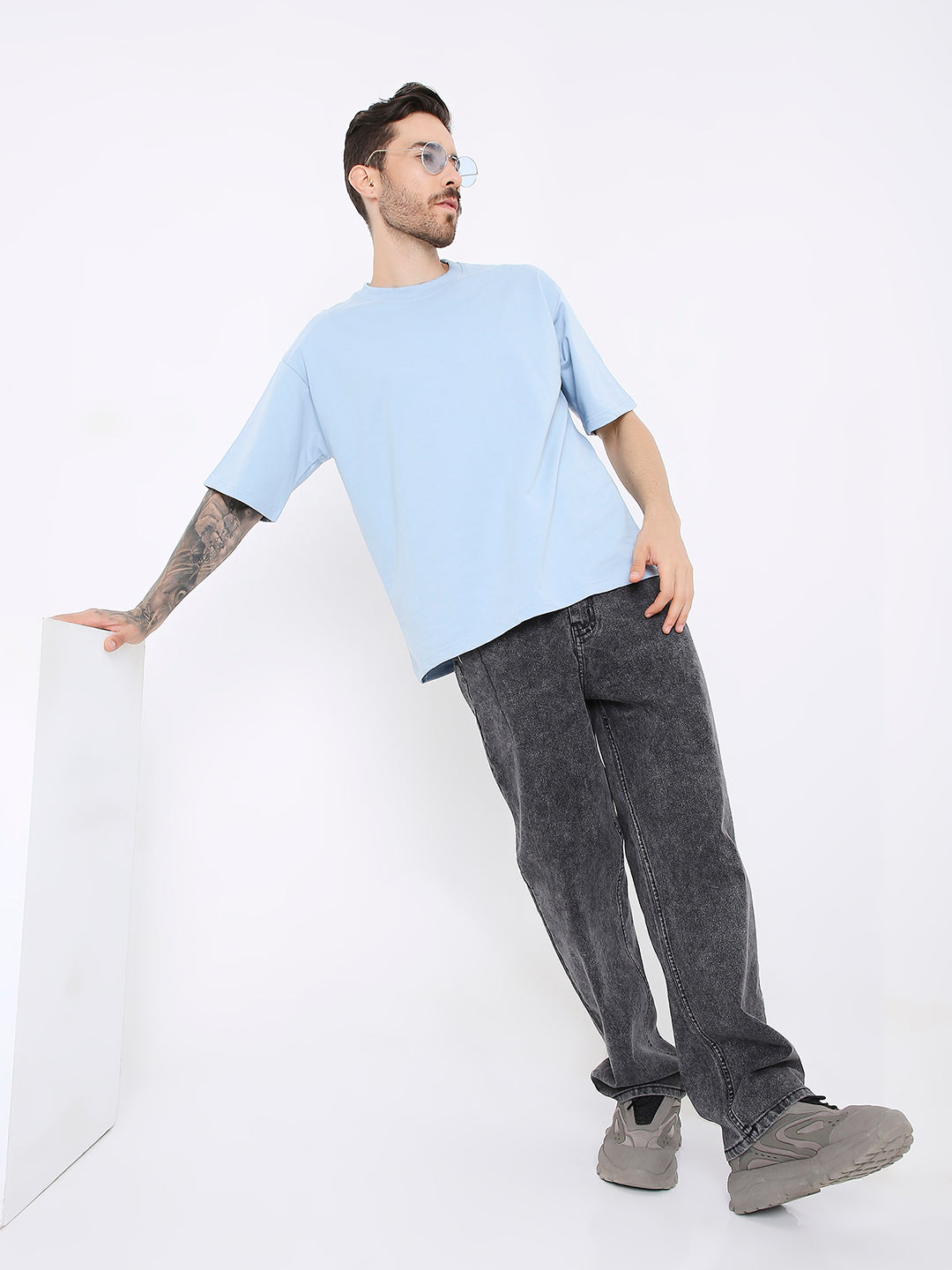 Oversize light blue solid t-shirt on male model with short sleeves and relaxed fit.