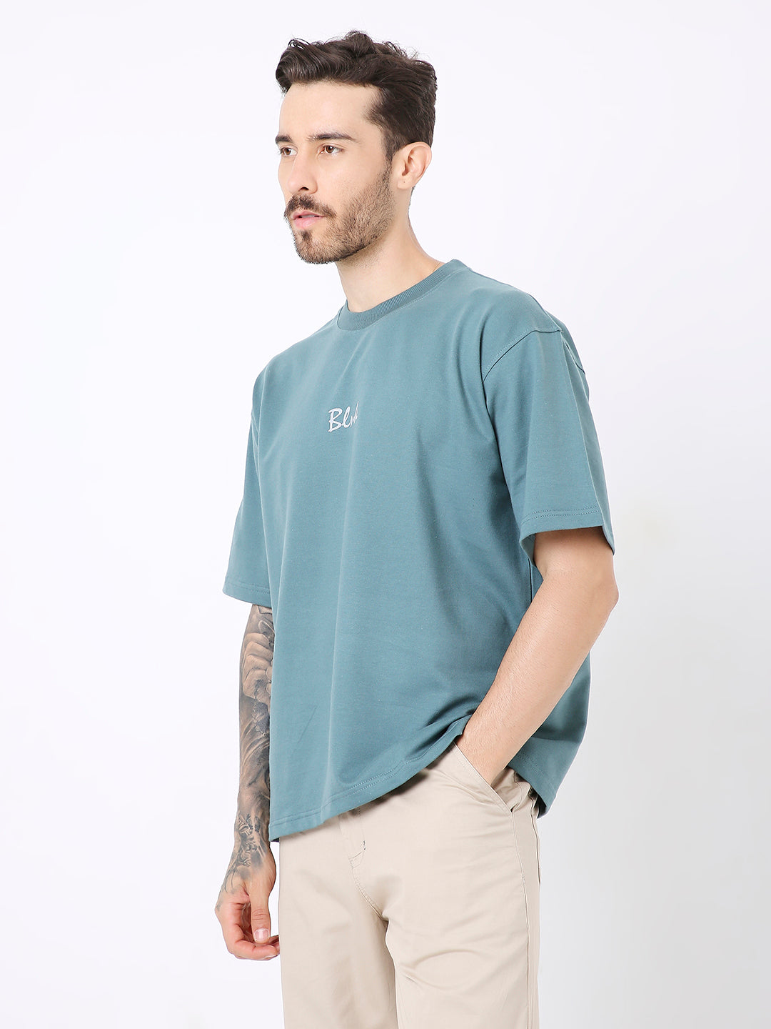 Oversize sapphire blue t-shirt with small white chest print and relaxed fit.
