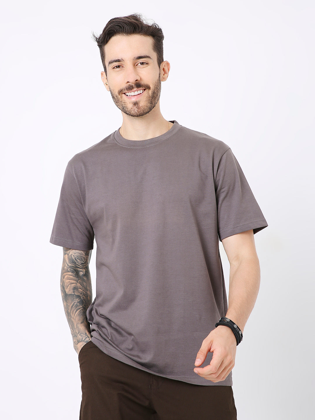 Relaxed fit steel grey solid short sleeve t-shirt on male model with tattoo and watch.