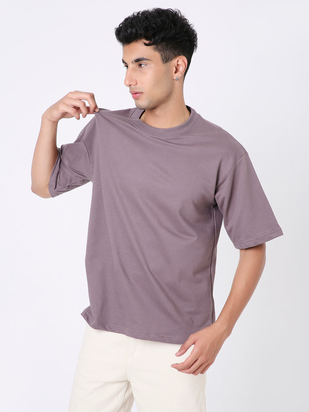Oversized old rose short-sleeve t-shirt with crew neck worn by male model.