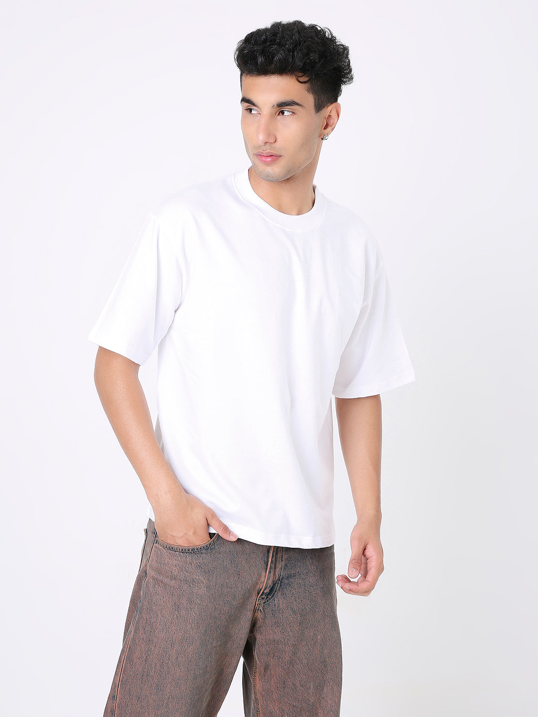 Oversize white short-sleeve t-shirt with crew neck on male model.