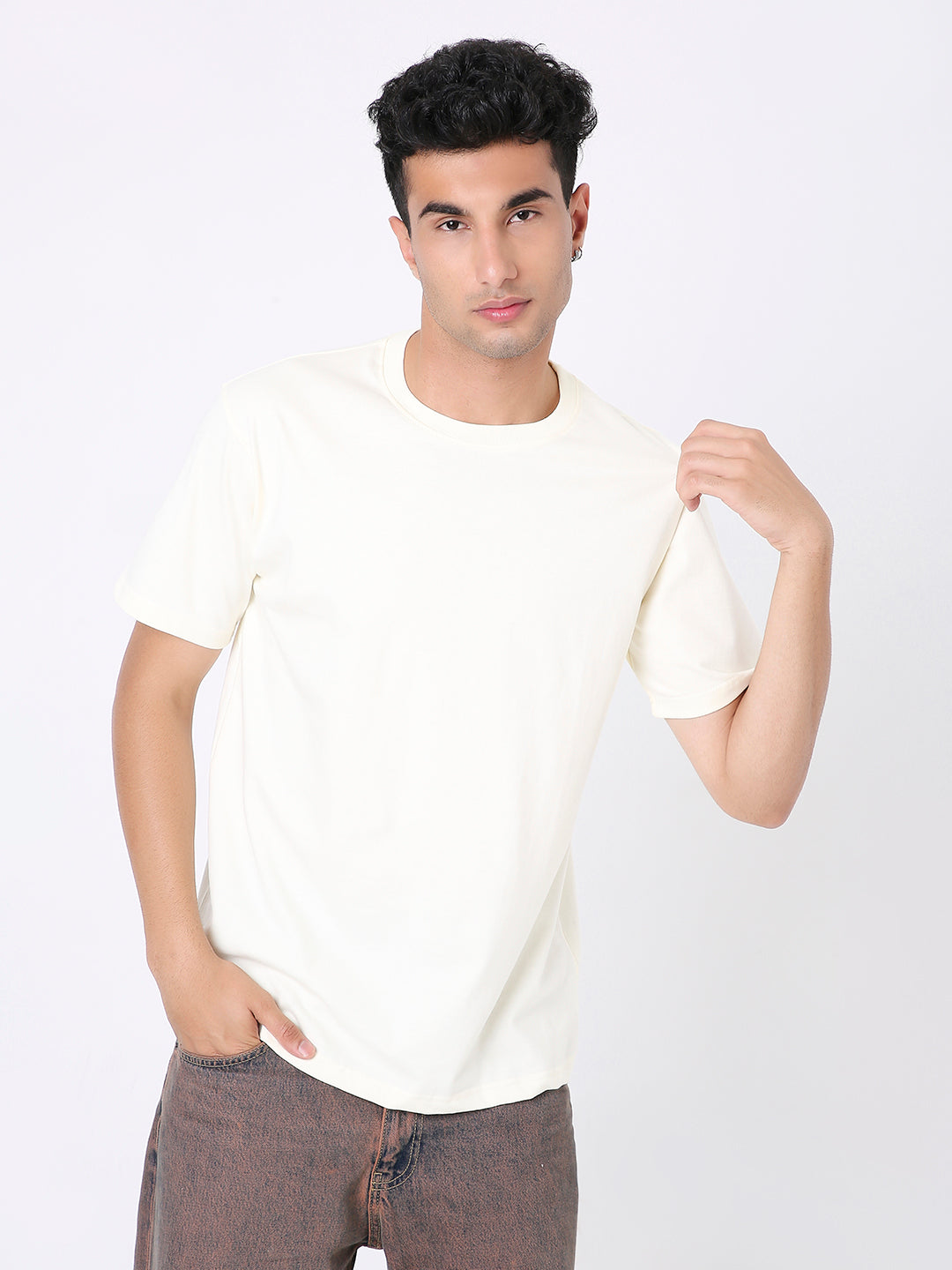 Off-white relaxed fit short-sleeve t-shirt worn by male model with crew neckline.