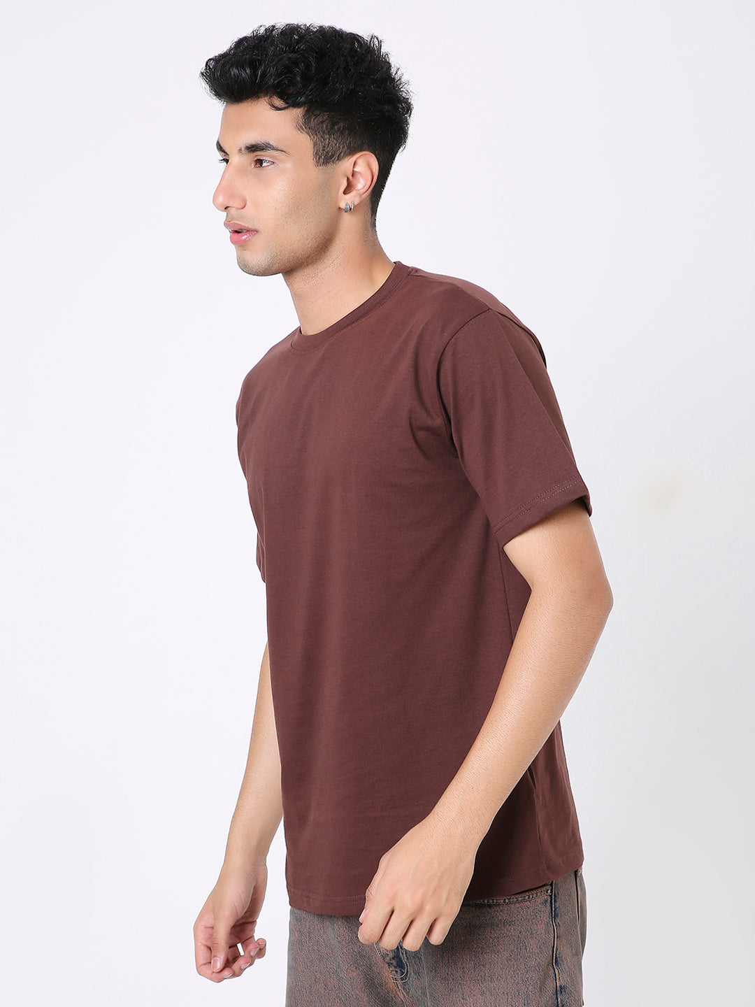 Brown relaxed-fit short-sleeve t-shirt with crew neck worn by male model in side view.