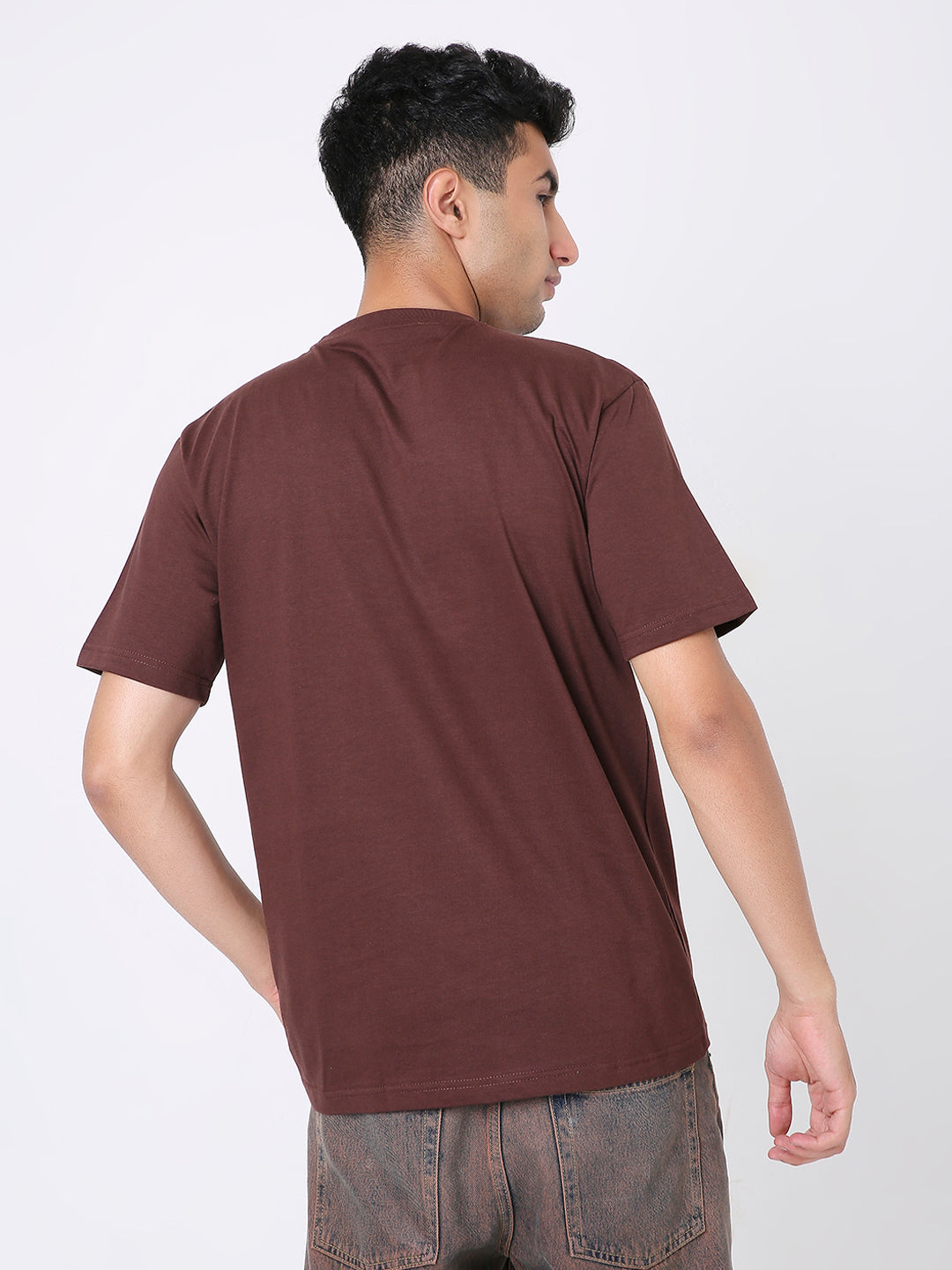 Brown short-sleeve relaxed fit t-shirt with crew neck, worn by male model from back view.