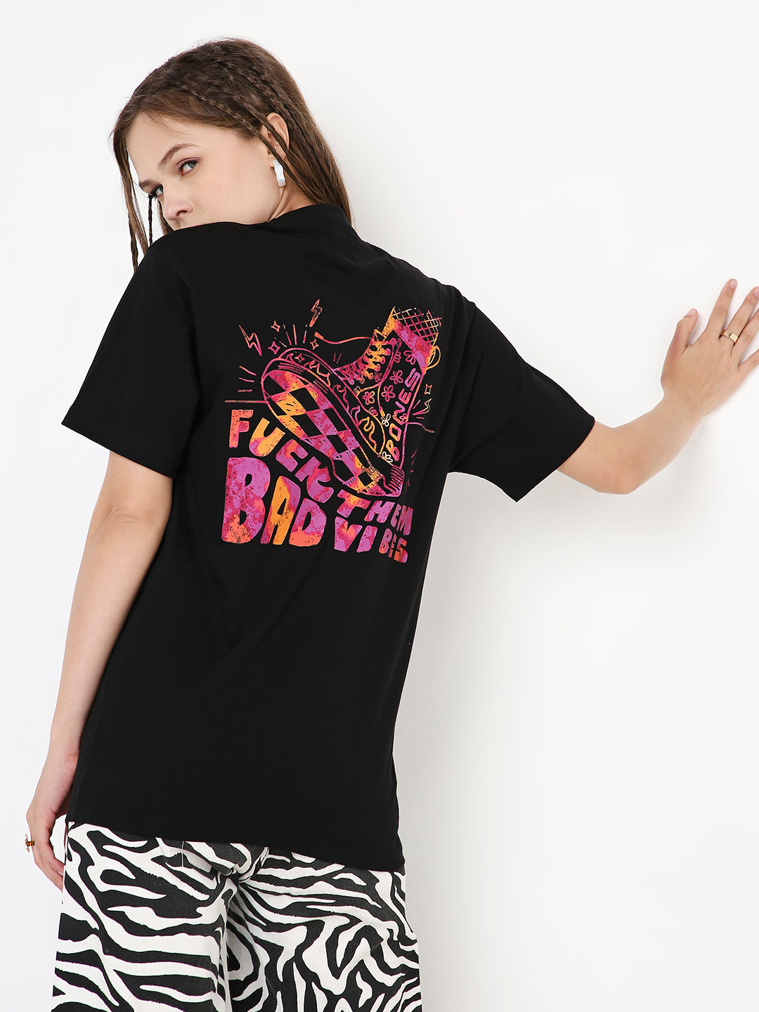 Black relaxed fit T-shirt with colorful pink and orange graphic print on back reading "Funky Bad Vibes".