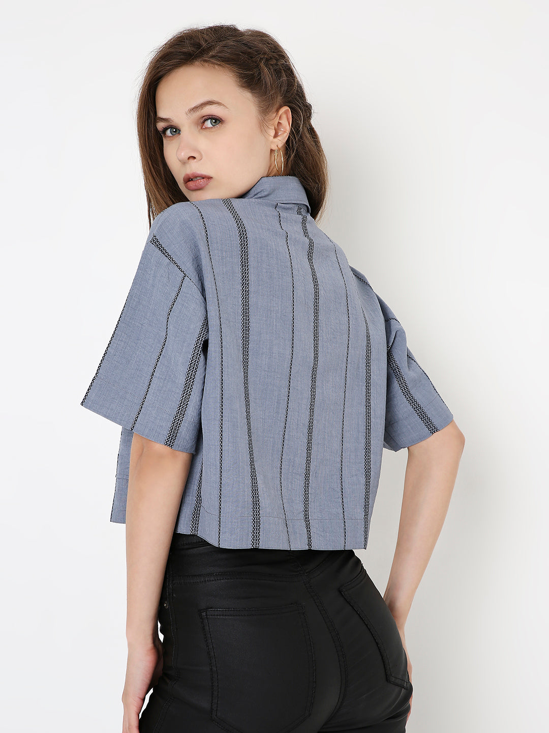 Blue cropped shirt with vertical dark stripes, short sleeves, and a relaxed fit shown from the back.