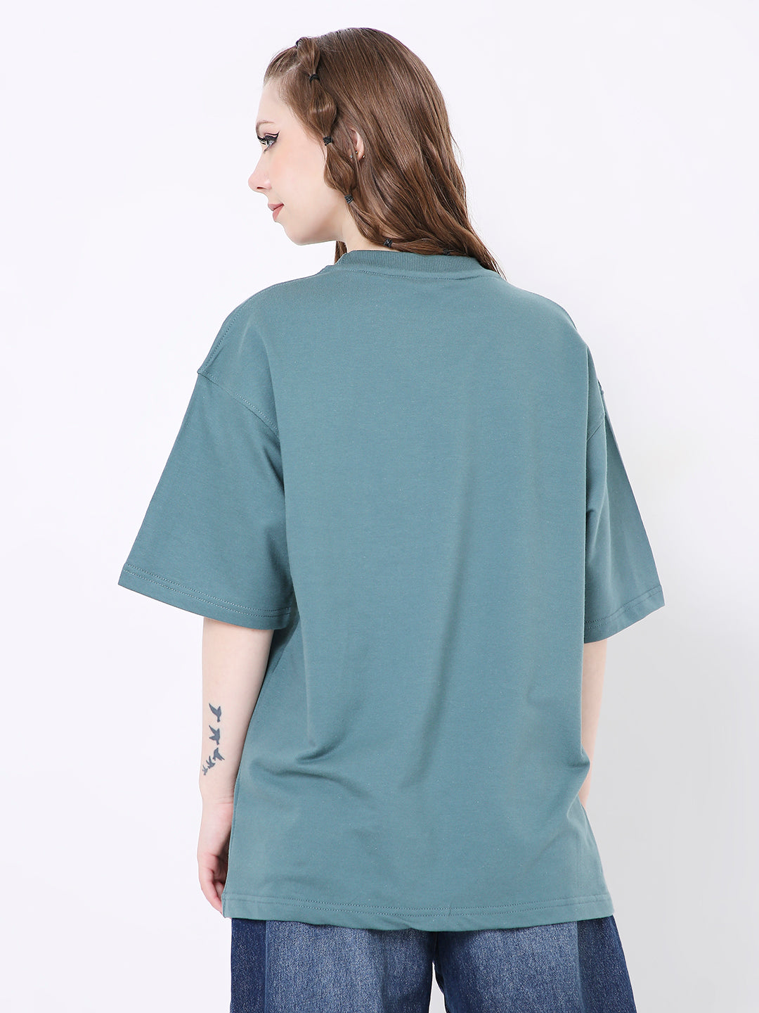 Oversize sapphire blue solid t-shirt with short sleeves and relaxed fit shown from back.